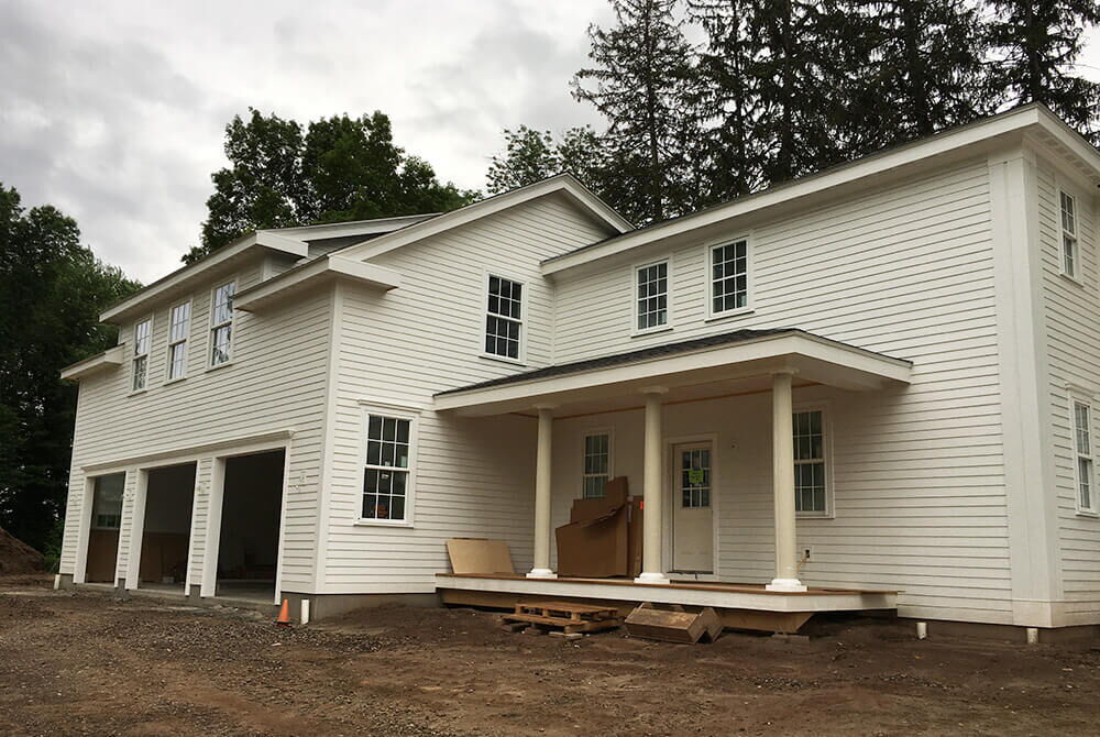 new home construction of home with three car garage and two stories