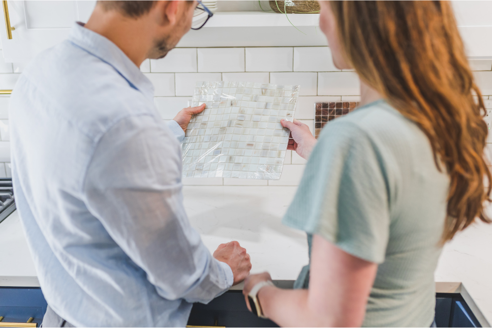 couple choosing backsplash for kitchen remodel