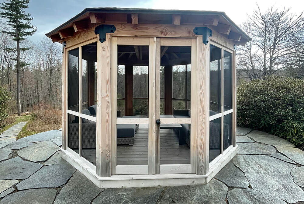 wooden screened in gazebo outside