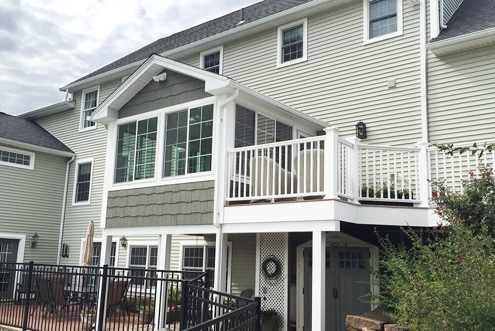 exterior view of sunroom with adjacent deck