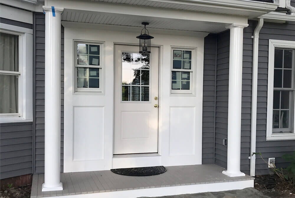 exterior view of white external door leading from porch